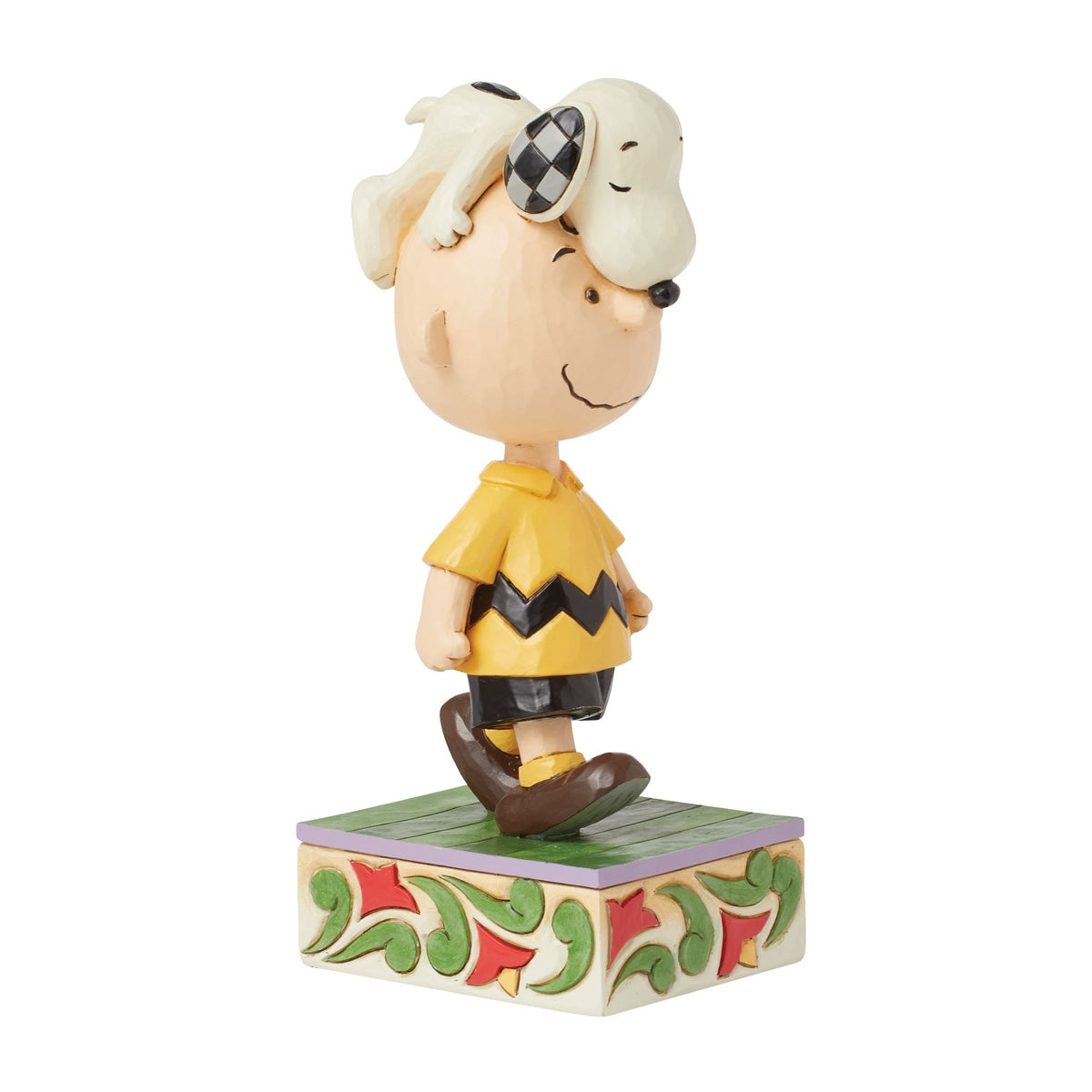 Snoopy on Charlie Brown's Head
