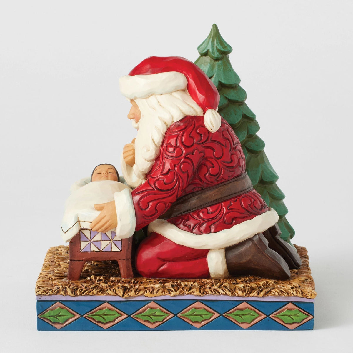 Santa Kneeling over Baby Jesus