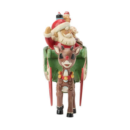 Rudolph Pulling Santa in Sled